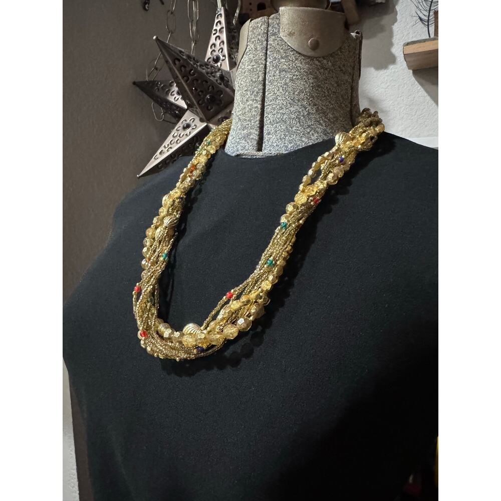 Layered gold statement necklace with major texture and movement